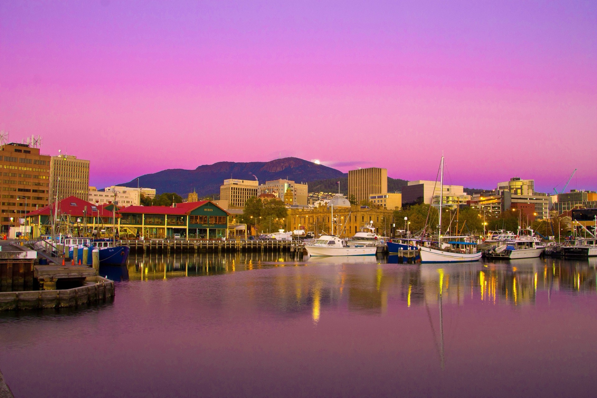 Hobart harbour waterfront with boats and city hills beyond