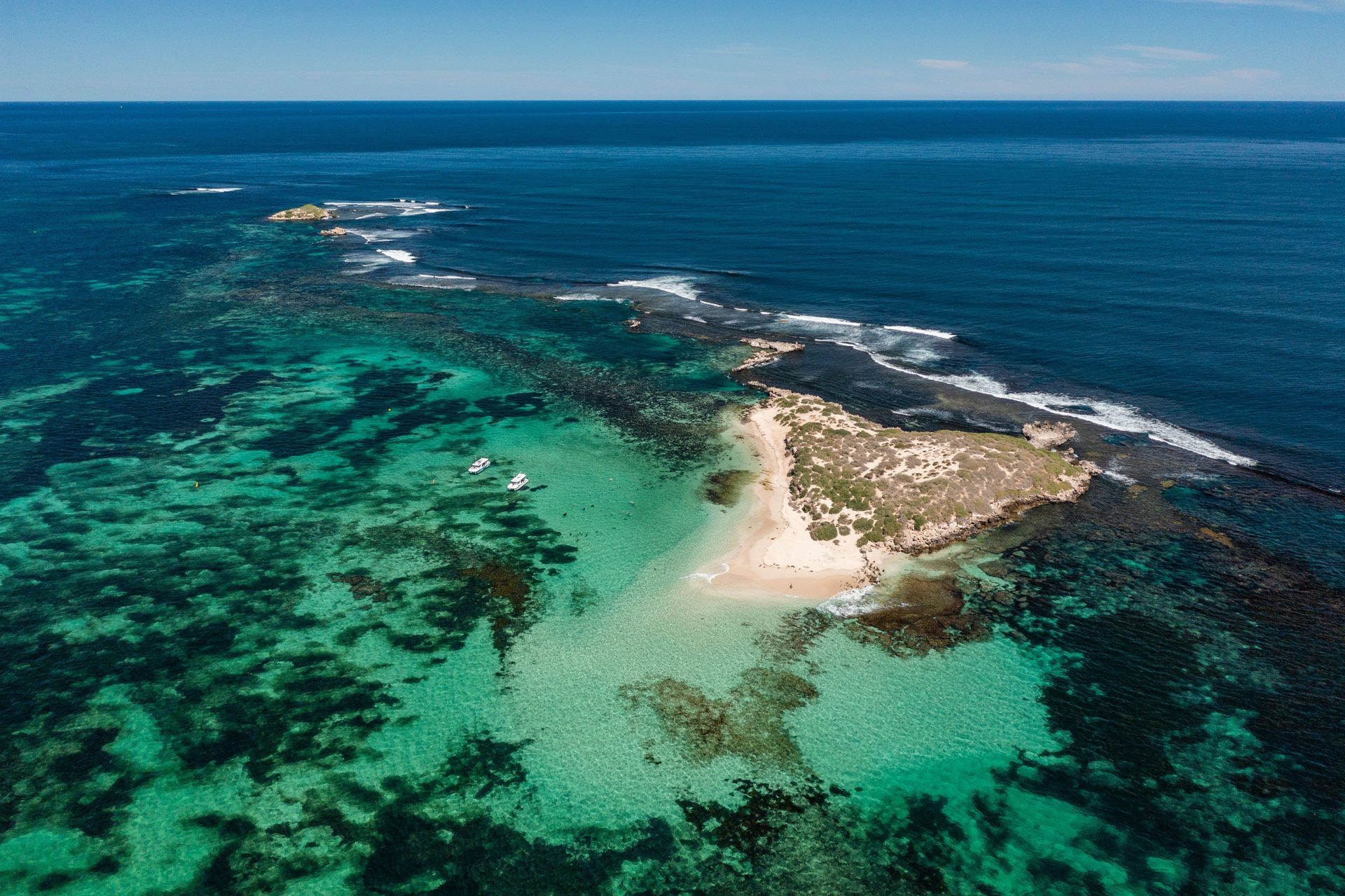 Clear turquoise water and boat activity off Jurien Bay